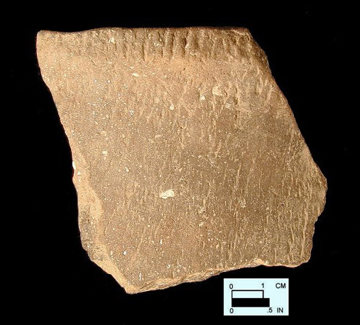 Keyser smoothed over cord-marked rim sherd from Hughes site 18MO1, Feature 22.